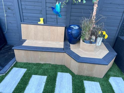 Millboard Enhanced Grain Golden Oak / Burnt Cedar bench and planter Erith DA8