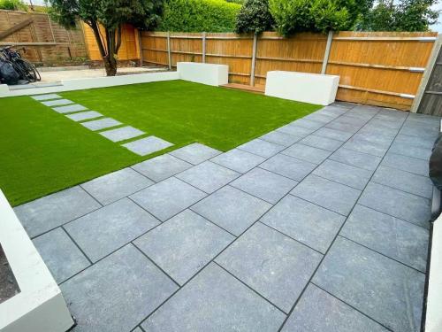 Grey Porcelain 600x600, full garden renovation, installing raise flower beds, rear retaining wall with new artificial grass.